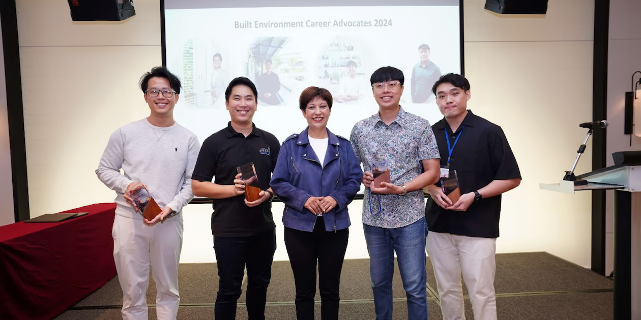Minister Indranee Rajah presenting Tokens of Appreciation to four BE Career Advocates, recognising their contributions to industry manpower development.